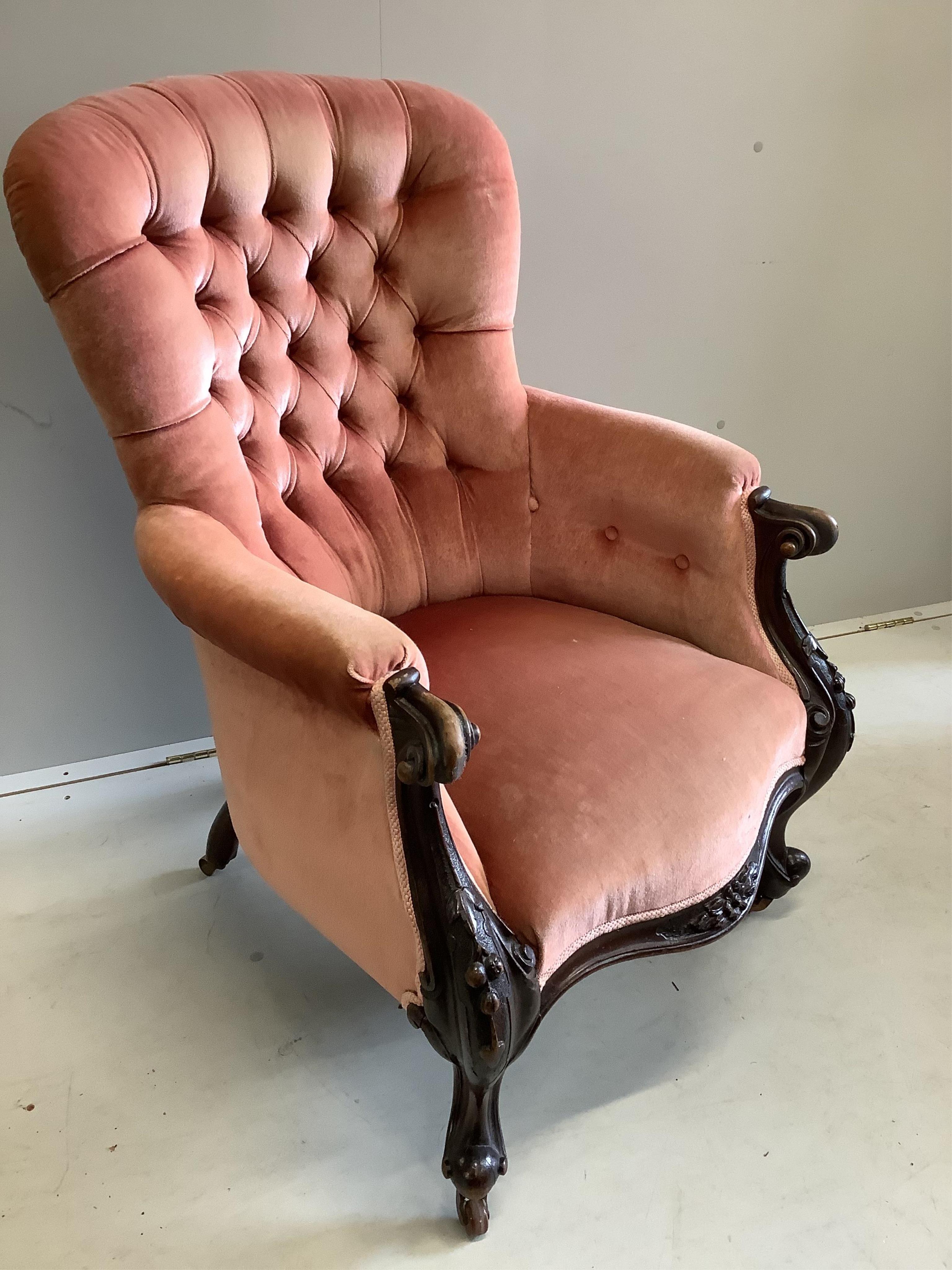 A Victorian mahogany upholstered spoon back armchair, width 70cm, depth 70cm, height 100cm